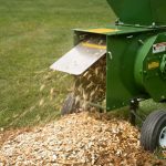 Wood Chips coming out of Mighty Mac Hammermill Shredder-Chipper