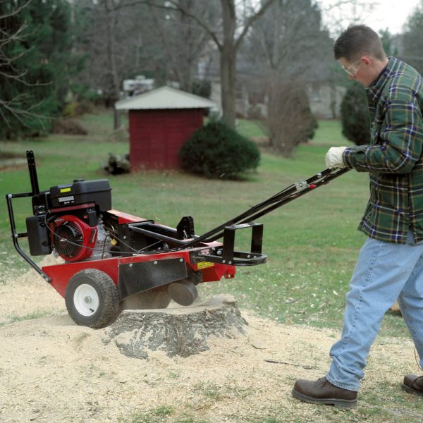 A Merry Commercial Stump Cutter being used to cut a stump