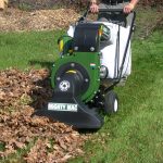 Mighty Mac Self-Propelled Vacuums being used to pick up a thick pile of leaves