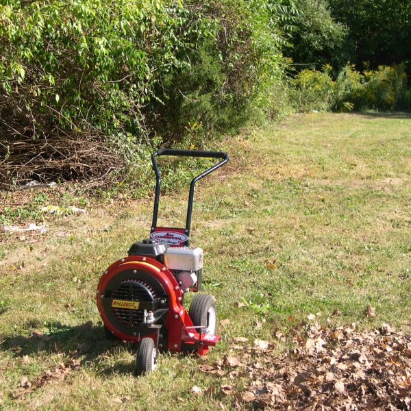 A Merry Commercial leaf blower standing in a clearing
