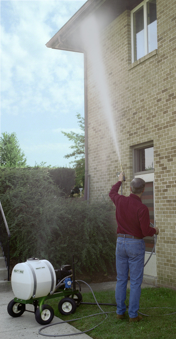 Mighty Mac PS322T 22 gallon Sprayer cleaning a house exterior wall