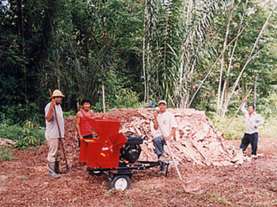 Use of a mighty mac wood chipper in a rainforest