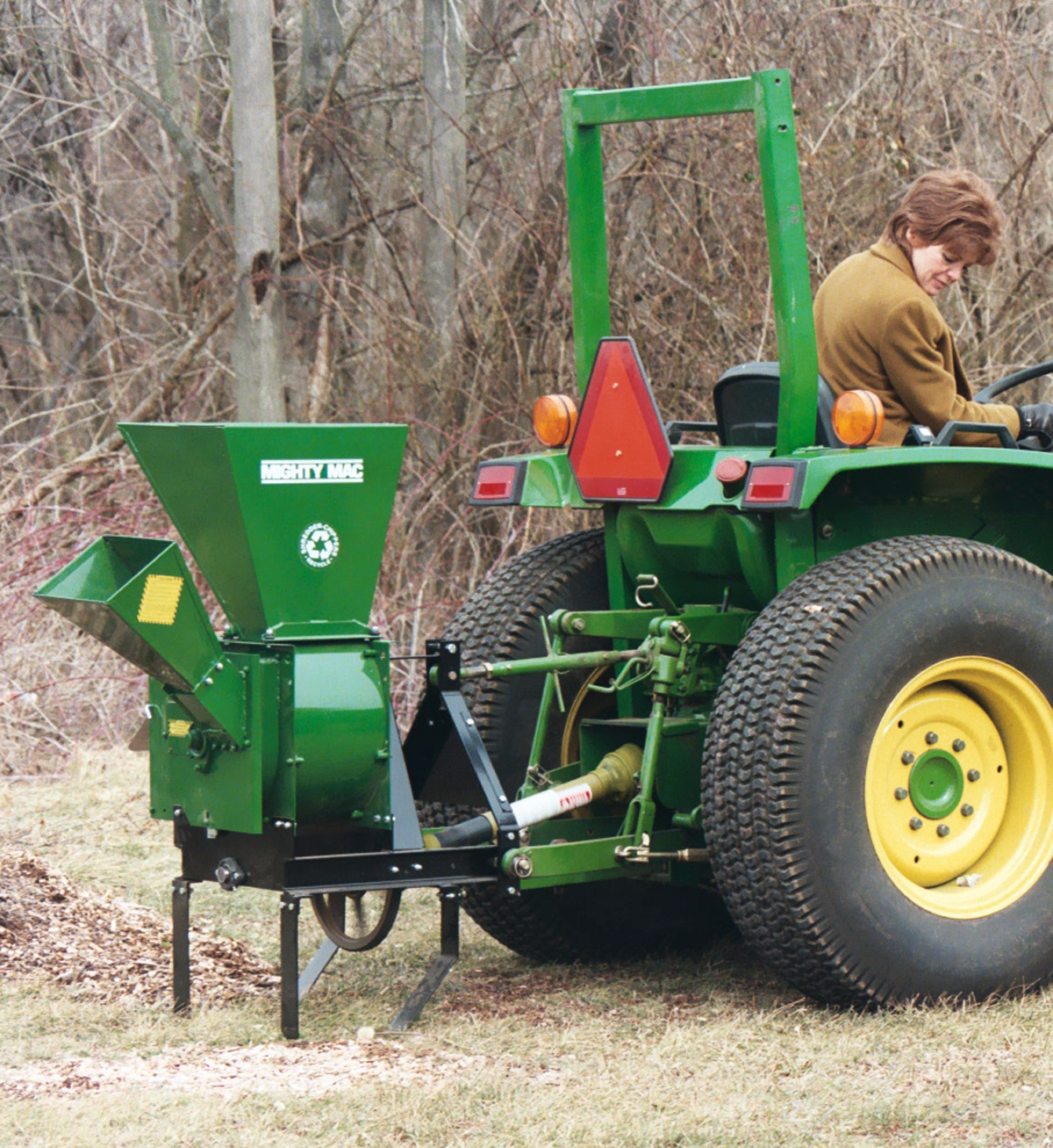 Mighty Mac TPH123 Three Point Hitch Shredder-Chipper being used in a field