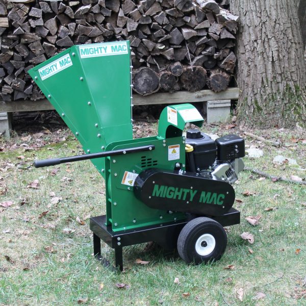 Mighty Mac Wood Chipper WC375 next to a woodpile